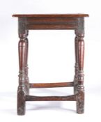 A Charles II oak joint stool, circa 1660 Having a rectangular top with simple moulded edge, run-