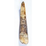 A rare James I bovine shoehorn, dated 1613 With charming naïve incised linear carving, to include