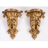 A pair of giltwood wall brackets, in the early 18th century Kentish manner, Each with a shaped bowed