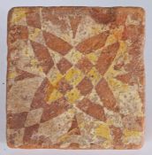 A 14th century floor tile, English  Decorated with a geometric intersecting quatrefoil design, 12.