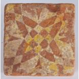 A 14th century floor tile, English  Decorated with a geometric intersecting quatrefoil design, 12.