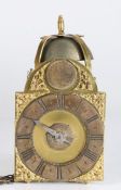 A miniature brass lantern clock, Tn Pyke, London The silvered chapter ring with Roman hours and gilt