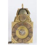 A miniature brass lantern clock, Tn Pyke, London The silvered chapter ring with Roman hours and gilt