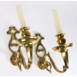 A pair of cast brass wall sconces, 18th century and later Each with a shaped and pierced backplate