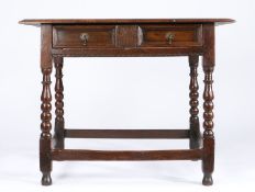 A Charles II oak side table, circa 1680 Having a triple-boarded and ovolo-moulded top, and a