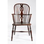 A 19th century ash and elm high-back Windsor armchair, English, circa 1830 The hooped back with