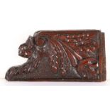 An early 17th century carved oak spandrel, English, circa 1600-30 Designed as the head of a mythical