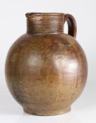 A large 17th century stoneware 'Bell-Ringers' jug, English Of ovoid form, with tall ribbed collar,