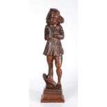 A 16th century carved oak figure of St. Roche Designed standing, with flat cap and shoulder-length