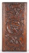 A 16th century oak panel, circa 1540 Designed with the bust of a male, wearing a brimmed hat, within
