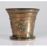 A small 17th century bronze mortar, English, circa 1650-80 Cast with a pair of cords, and four times