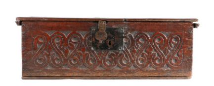 A mid-17th century oak boarded box, English, circa 1650 Having a rectangular hinged lid, the front