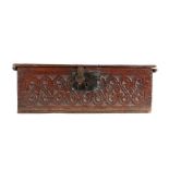 A mid-17th century oak boarded box, English, circa 1650 Having a rectangular hinged lid, the front