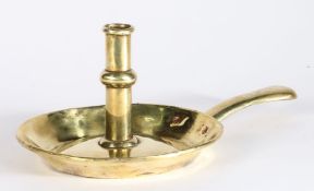 An early 18th century brass ejector candlestick, circa 1700-20 The stem centred by a shallow ball-