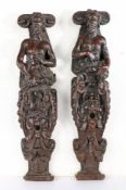 A pair of early 17th century oak figural terms, circa 1600-20 Each carved in high relief, designed