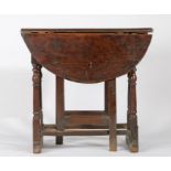 A William & Mary oak gateleg occasional table, circa 1690 Having an oval drop-leaf top formed from