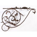 An early 18th century decorative wrought iron candle wall bracket With scrolling and acanthus-leaf