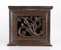 A rare mid-17th century oak table-top food safe, English, circa 1640-80 Of boarded construction,