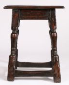 A Charles I oak joint stool, circa 1640 Having an ovolo-moulded top, run-moulded rails and rising-