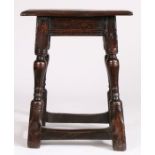 A Charles I oak joint stool, circa 1640 Having an ovolo-moulded top, run-moulded rails and rising-