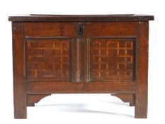 A small Elizabeth I joined oak and inlaid coffer, circa 1570 Having an impressive single panelled