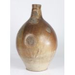 A large early 17th century stoneware bellarmine, Cologne/Frechen, circa 1600 Having a mottled or