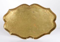 A well-shaped brass tray, Dutch, circa 1800 Of serpentine-sided oval form, with flared rolled rim,