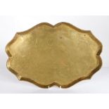 A well-shaped brass tray, Dutch, circa 1800 Of serpentine-sided oval form, with flared rolled rim,