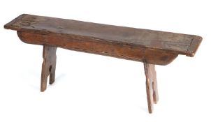 An oak boarded form, parts possibly 16th century With rectangular end-cleated top,  round-ended