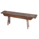 An oak boarded form, parts possibly 16th century With rectangular end-cleated top,  round-ended