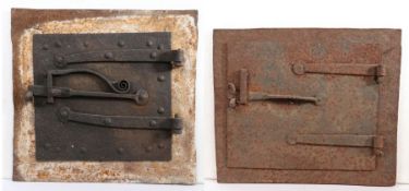 A 17th century iron bread-oven door, English With two strap hinges and scroll-work latch handle,