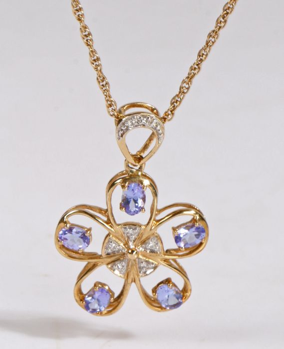 A 9 carat gold diamond and pendant together with a 9 carat gold chain, the pendant in the form of