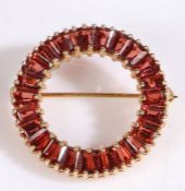 9 carat gold gem set brooch, with a circular design set with baguette stones, 27mm diameter, 5 grams
