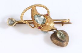 A 19th Century yellow metal bar brooch in the form of a snakes head, the snakes head set with a