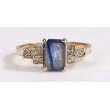 An Art Deco style 9 carat gold sapphire and diamond set ring, having a central emerald cut