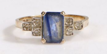 An Art Deco style 9 carat gold sapphire and diamond set ring, having a central emerald cut