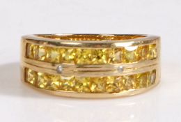 A 9 carat gold yellow sapphire and diamond ring, the ring set with two rows of ten princess cut