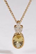 A Unoaerre 9 carat gold diamond and citrine pendant and chain, with an oval citrine with diamonds