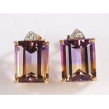 A pair of 9 carat gold ametrine and diamond earrings, the earrings set with a claw mounted