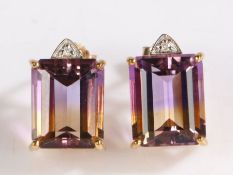 A pair of 9 carat gold ametrine and diamond earrings, the earrings set with a claw mounted