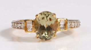 A 18 carat gold zultanite and diamond ring, the head set with a claw mounted oval cut zultanite