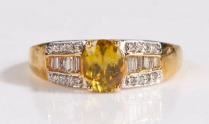 A 18 carat gold ambilobe sphene and diamond ring, the head set with a claw mounted oval cut ambilobe