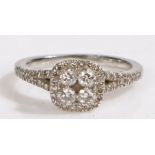 A platinum diamond cluster halo ring, total diamond approximately 0.40 carat Ring size I. Weighing