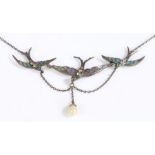 An antique silver and enamel/glass necklace formed of three swallows, each with a red gemset eye and