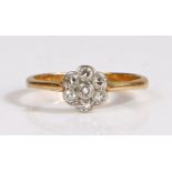 An 18 carat gold and diamond flower cluster ring, set throughout with old brilliant-cut diamonds, in