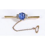 18 carat gold, Platinum, Tanzanite and Diamond Bar Brooch, having a large oval cushion cut tanzanite