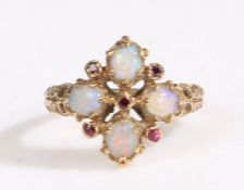 An antique opal and gemset ring, having four oval cut opals accented by five red stones, mounted