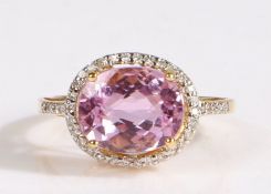 18 carat gold and kunzite ring, having an oval cut kunzite to the centre, weighing 4.46 carats and a
