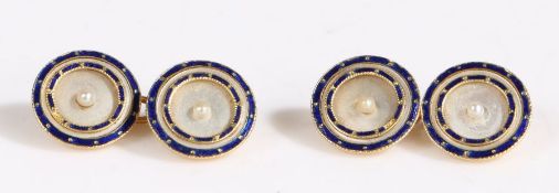 A pair of 18 carat gold and mother-of-pearl cufflinks, the round mother of pearl plaques each