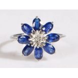 A 9 carat white gold AAA ceylon sapphire and diamond ring, the head in the form of a flower set with